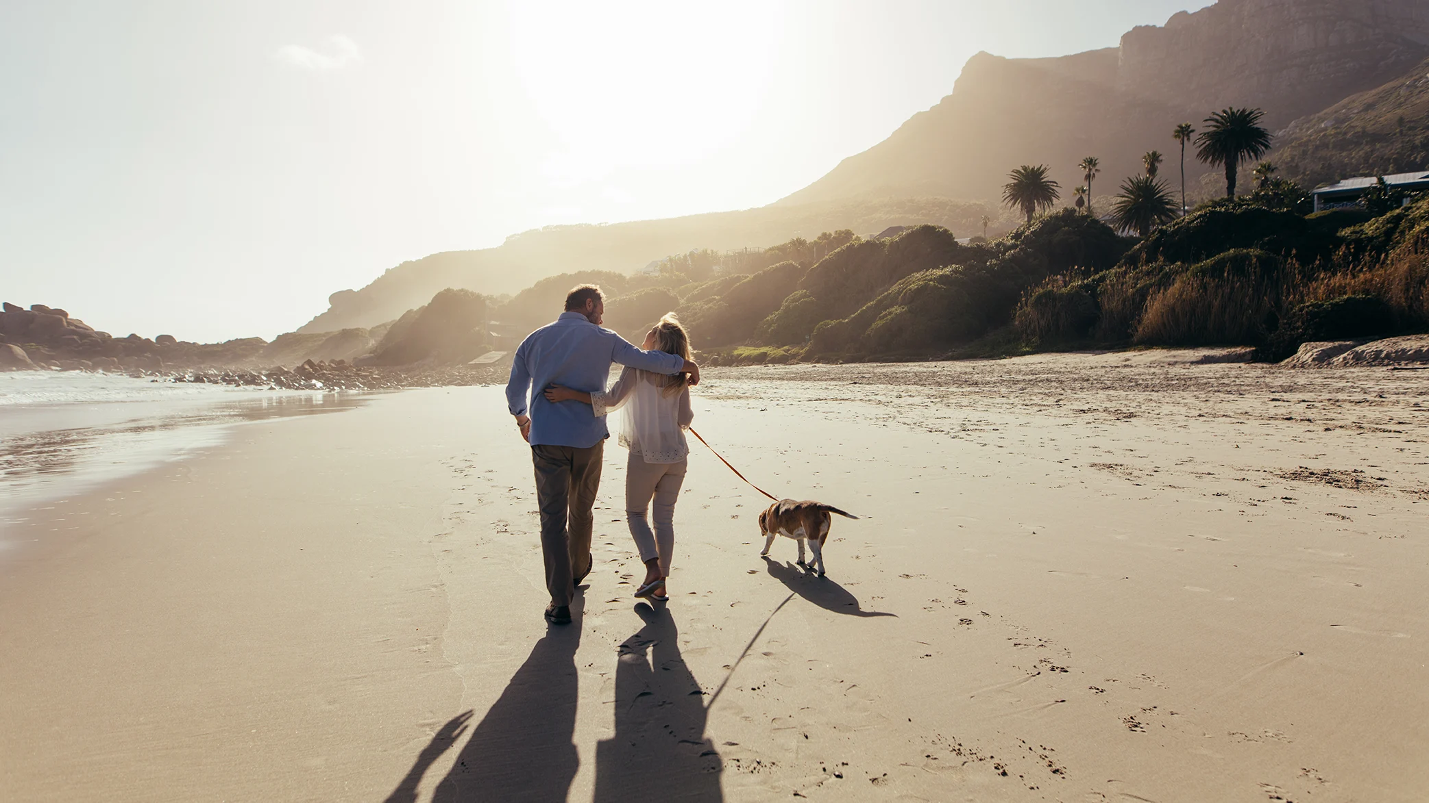 Retired Couple Walking Down The Beach in North Cyprus